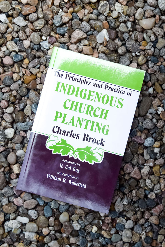 Indigenous Church Planting book on background with pebbles